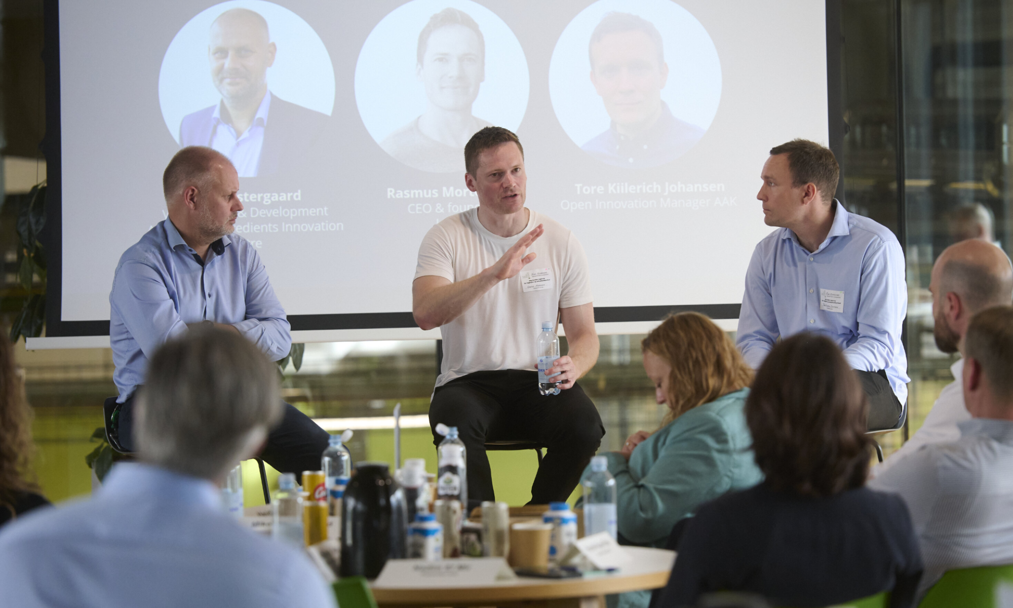 Three industry representatives participating in a panel discussion at the Arla Foods Ingredients Innovation Centre.